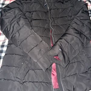 medium black Tommy Hilfiger puffer jacket.